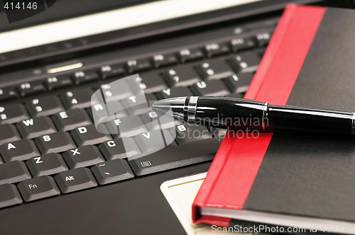 Image of laptop and notebook