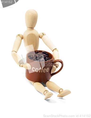 Image of wood mannequin and coffee