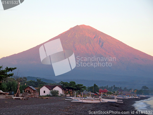 Image of Bali, mountain and fishing boats on the shore