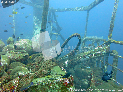 Image of massive shipwreck, sits on a sandy seafloor in bali
