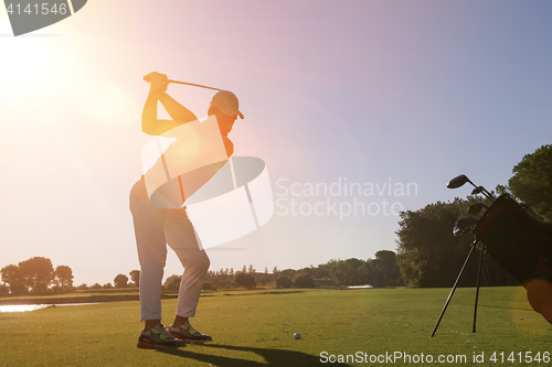 Image of golf player hitting shot with club