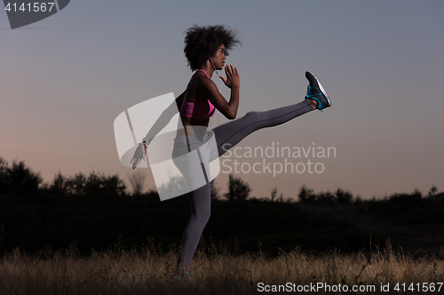 Image of black woman is doing stretching exercise relaxing and warm up