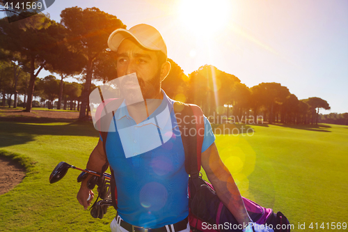 Image of handsome middle eastern golf player at the course