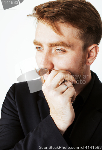 Image of young red hair man with beard and mustache in black suit on whit