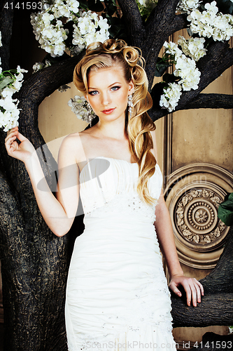 Image of beauty young bride alone in luxury vintage interior with a lot of flowers close up