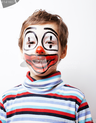 Image of little cute boy with facepaint like clown, pantomimic expression