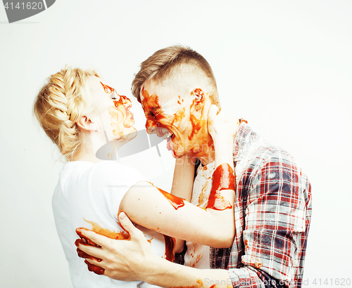 Image of young pretty couple, lifestyle people concept: girlfriend and boyfriend cooking together, having fun, making mess isolated on white background