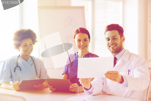 Image of group of happy doctors meeting at hospital office