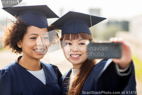 Image of students or bachelors taking selfie by smartphone