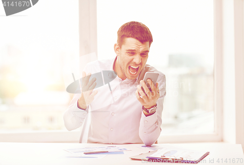 Image of close up of businessman with smartphone