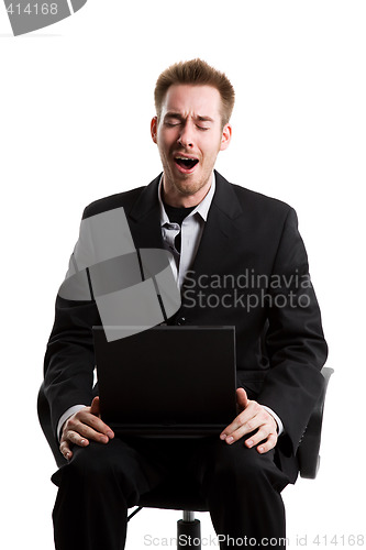 Image of Yawning businessman