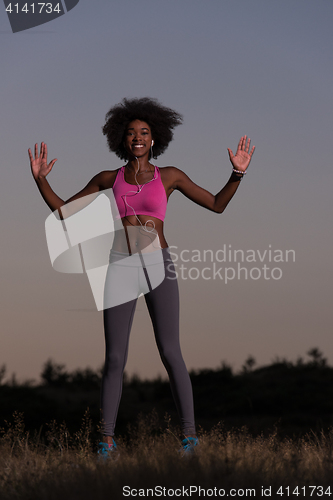 Image of black woman is doing stretching exercise relaxing and warm up