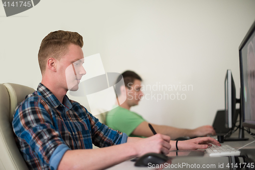 Image of a group of graphic designers at work