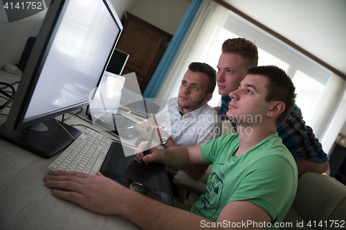 Image of a group of graphic designers at work