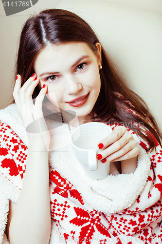 Image of young pretty brunette girl in Christmas ornament blanket getting warm on cold winter, freshness beauty concept, lifestyle people