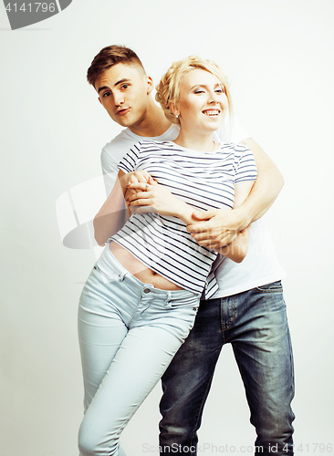 Image of young pretty teenage couple, hipster guy with his girlfriend happy smiling and hugging isolated on white background, lifestyle people concept