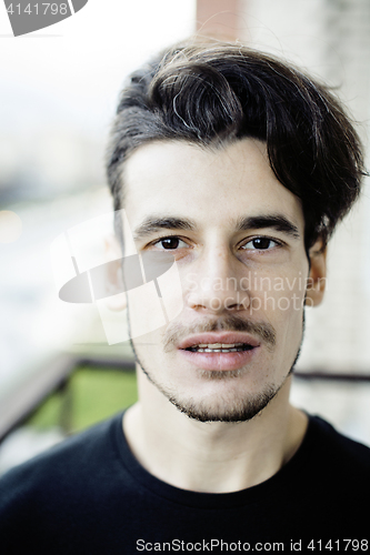 Image of young pretty hipster guy smiling on street, lifestyle people concept