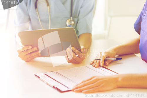 Image of close up of doctors with tablet pc at hospital