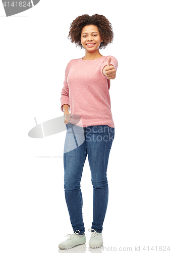 Image of happy african american woman showing thumbs up