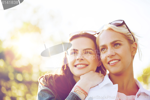 Image of happy young women or teenage girls outdoors