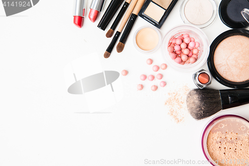 Image of Brush and cosmetic on a white background