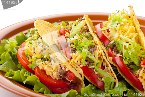 Image of beef tacos with salad and tomatoes salsa