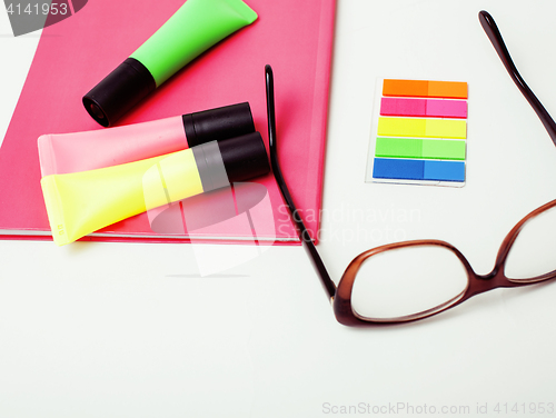 Image of business, education and technology concept - close up of notebook, paper stickers, pencil different stuff on white background