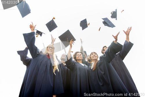 Image of happy students throwing mortar boards up