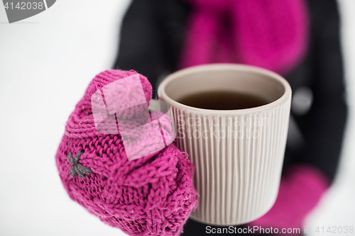 Image of close up of woman with tea mug outdoors in winter