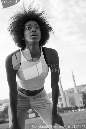 Image of Portrait of sporty young african american woman running outdoors