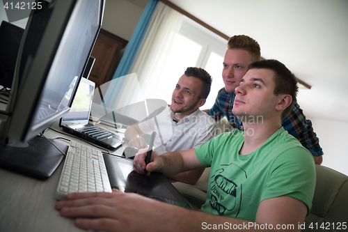 Image of a group of graphic designers at work