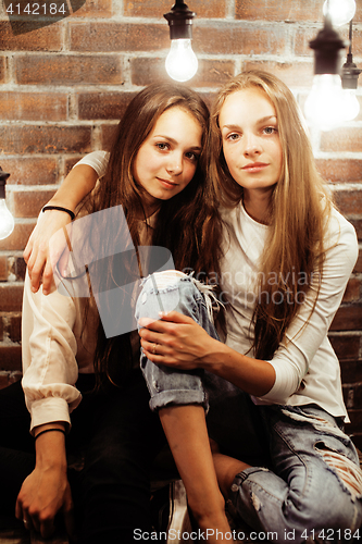 Image of pretty teenage girl having fun in stylish modern loft studio, lifestyle people concept