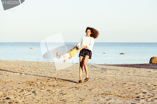 Image of pretty diverse nation and age friends on sea coast having fun, lifestyle people concept on beach vacations