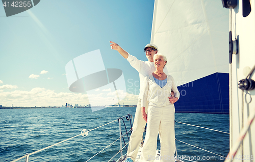 Image of senior couple sailing on boat or yacht in sea