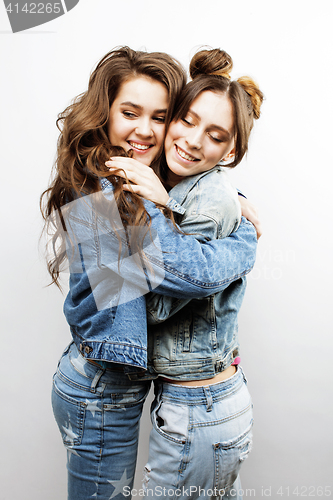 Image of lifestyle and people concept: Fashion portrait of two stylish sexy girls best friends, over white background. Happy time for fun.