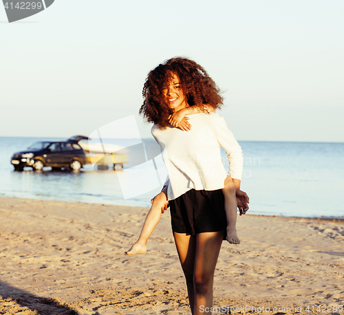 Image of pretty diverse nation and age friends on sea coast having fun, lifestyle people concept on beach vacations