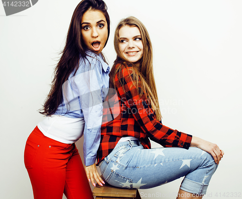 Image of best friends teenage girls together having fun, posing emotional on white background, besties happy smiling, lifestyle people concept, blond and brunette multi nations