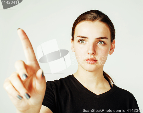 Image of young pretty girl pointing on white background, business science