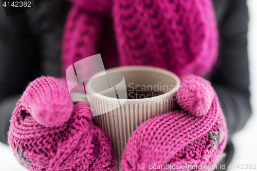 Image of close up of woman with tea mug outdoors in winter