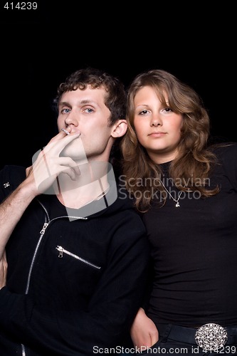 Image of The young couple. Isolated on a black background