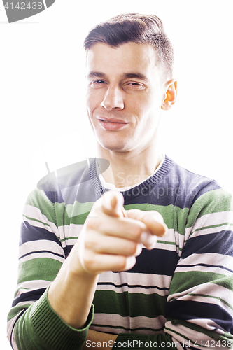 Image of Portrait of a smart serious young man standing against white bac