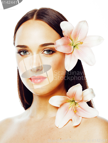 Image of young attractive lady close up with hands on face isolated flowe