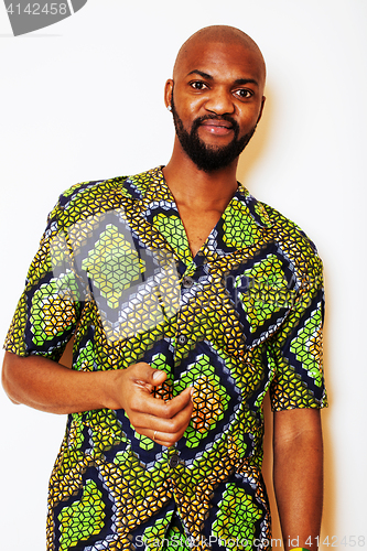 Image of portrait of young handsome african man wearing bright green nati