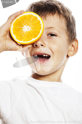 Image of little cute boy with orange fruit double isolated on white smili