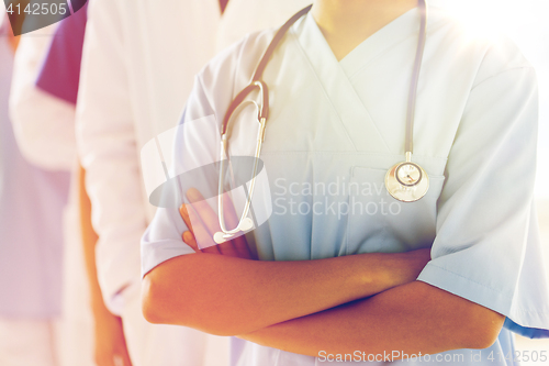 Image of close up of african female nurse with stethoscope