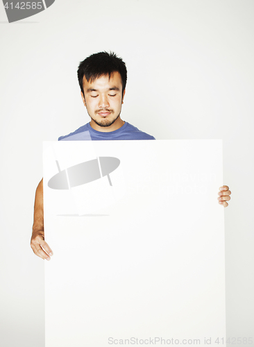 Image of pretty cool asian man holding empty white plate smiling