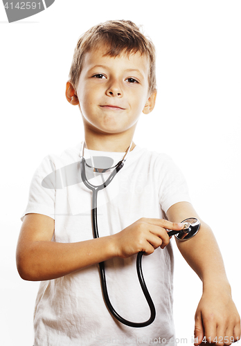 Image of little cute boy with stethoscope playing like adult profession d