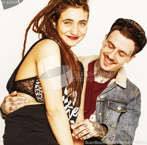 Image of Young couple together making love, hugging. guy with tattoo, gir