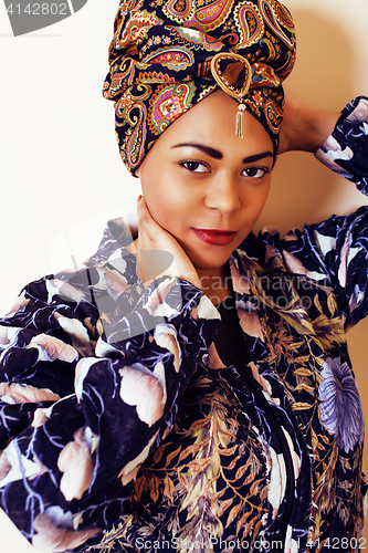 Image of beauty bright african woman with creative make up, shawl on head like cubian closeup smiling, cheerful tan mulatto, lifestyle people concept