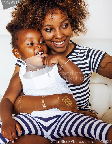 Image of adorable sweet young afro-american mother with cute little daugh